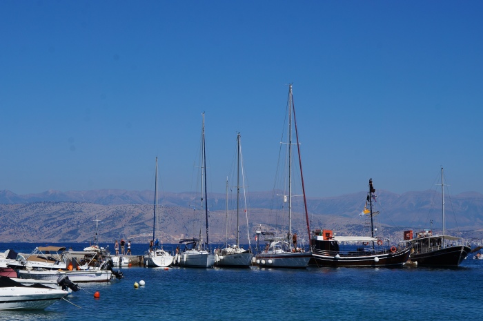 Boats by the bay; behind is a beautiful mountain range view